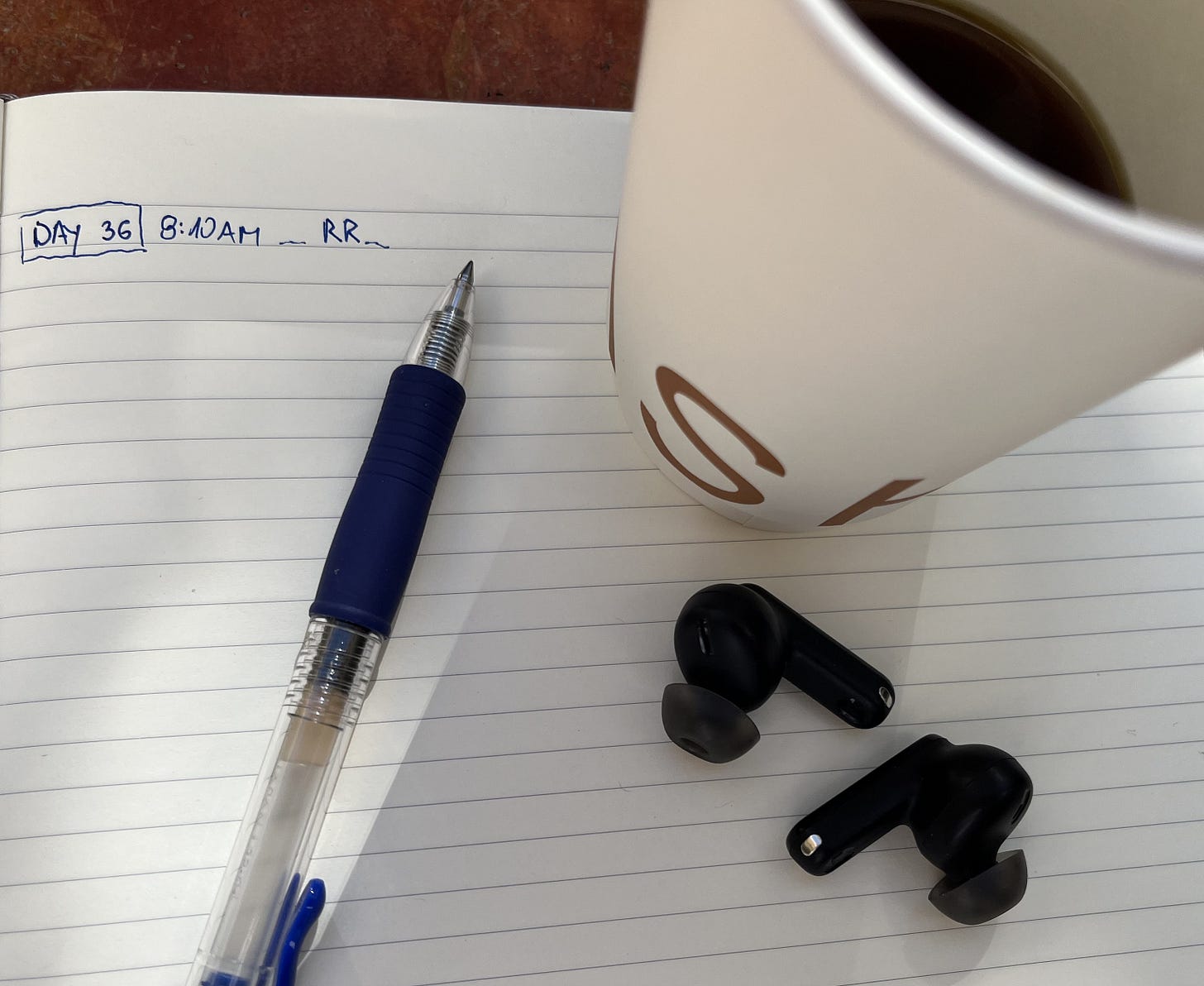 Drip coffee, moleskine journal, and morning jazz - the Riyadh Reset routine that rebuilt pride one rep at a time.